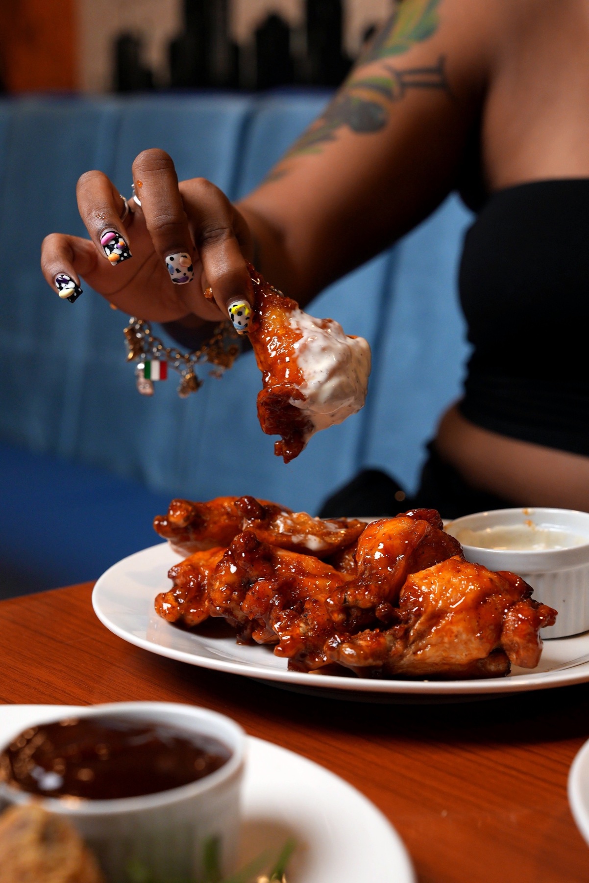Sauced wings served at Tempo